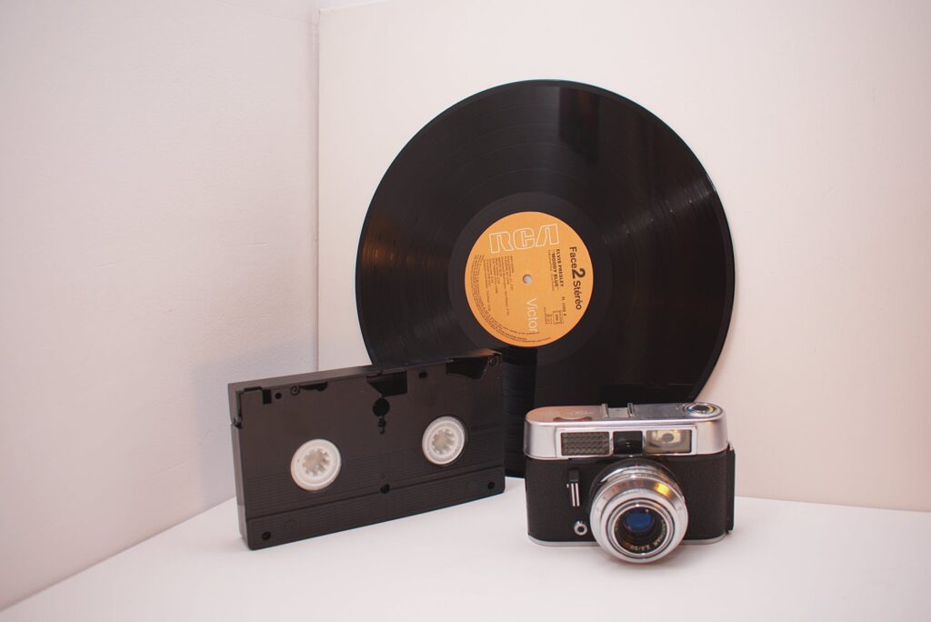 black vinyl disc black vhs tape and camera